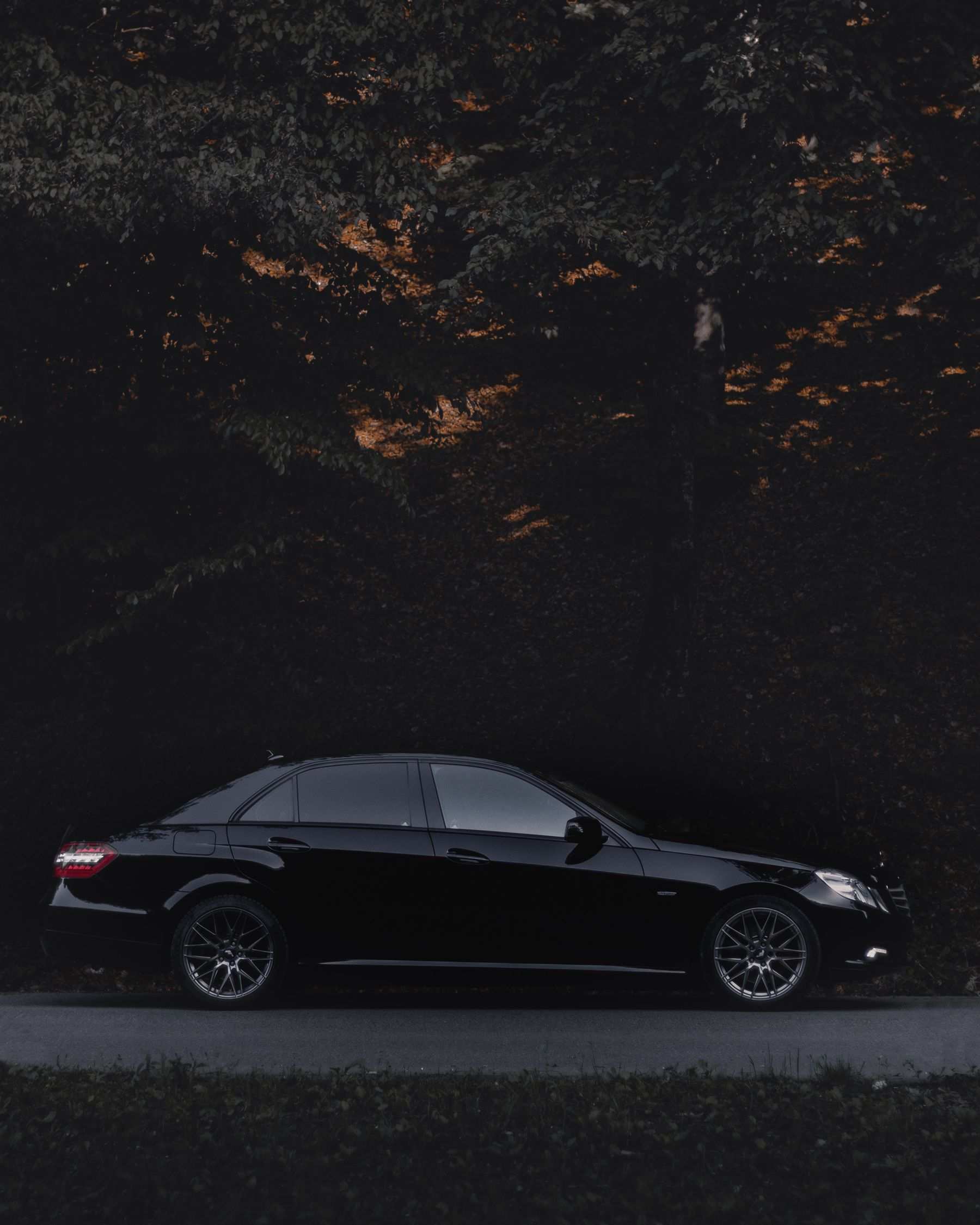 Black premium sedan in evening light